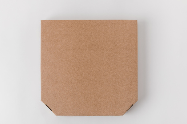 pohled shora z hnědého papíru pizza krabice - Fotografie, Obrázek