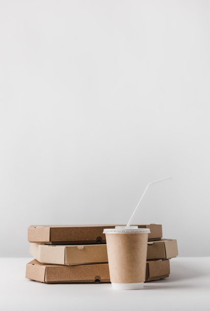 pizza boxes and disposable coffee cup on table - Photo, Image