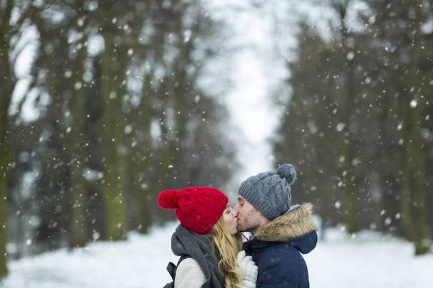 Couple in love in winter scenery - Фото, изображение