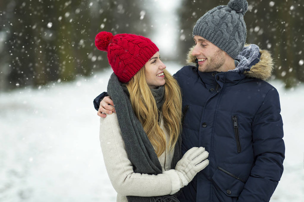 Couple in love in winter scenery - Foto, imagen
