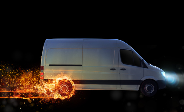 Super fast delivery of package service. van with wheels on fire on the road - Photo, Image