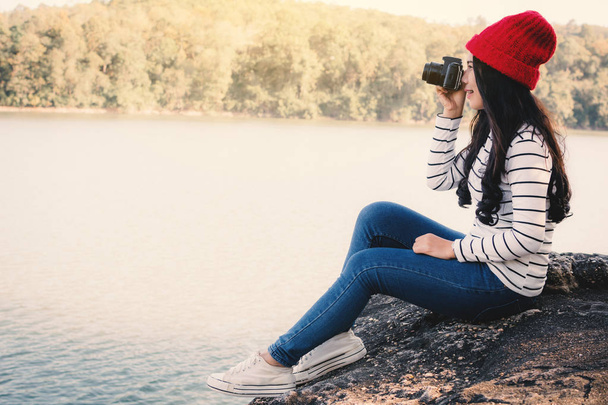 Asian woman shooting picture in nature , Relax time on holiday concept travel,selective and soft focus,tone of hipster style - 写真・画像