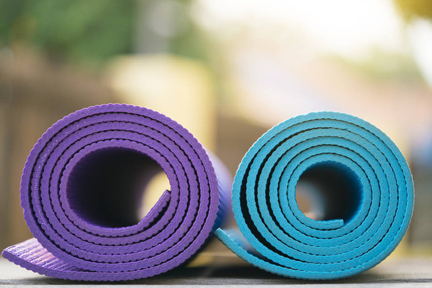 close up of colorful yoga mat on the table, sport and healthy co - Φωτογραφία, εικόνα