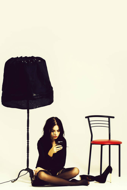 sexy woman with lamp and chair - Φωτογραφία, εικόνα