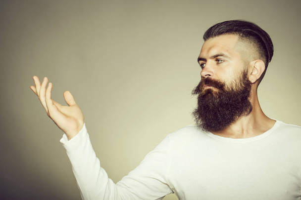 Bearded man with raised hand - Zdjęcie, obraz
