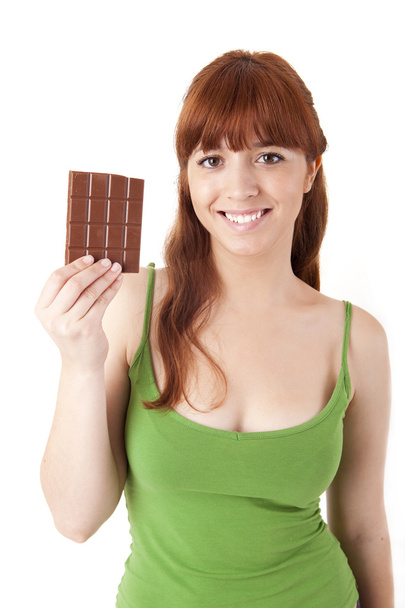 όμορφη νεαρή γυναίκα εκμετάλλευση σοκολάτα - Φωτογραφία, εικόνα