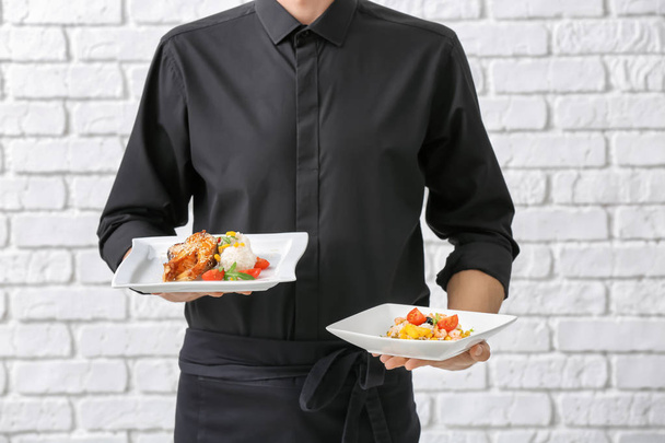 Waiter holding plates - Valokuva, kuva