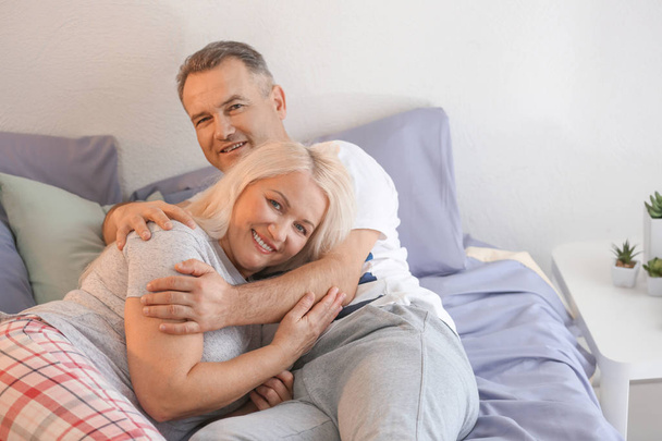 Senior couple on bed  - Фото, зображення