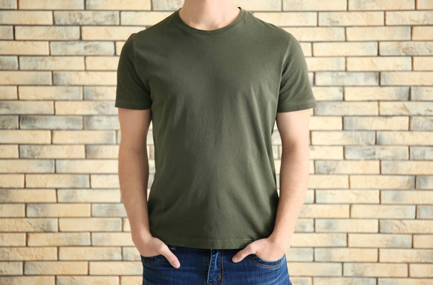 Young man in stylish t-shirt  - Фото, изображение
