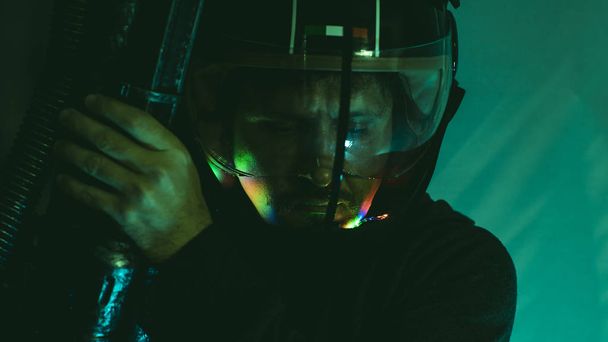 Warrior, cyborg man of the future with helmet lights led and huge laser gun - Fotografie, Obrázek