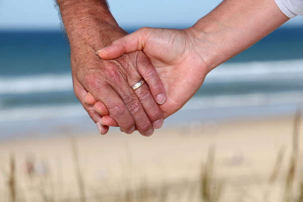 Senior couple holding hands - Фото, зображення