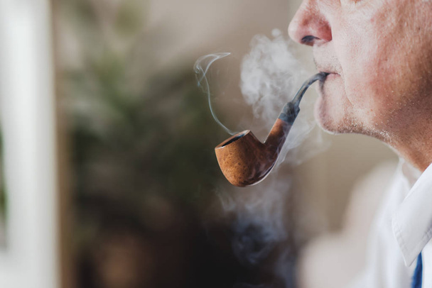 Senior pipe smoker - Fotó, kép