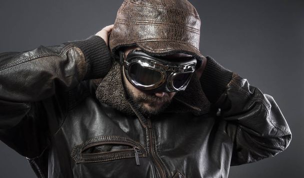 Aircraft, old airplane pilot with brown leather jacket, arador hat and large glasses - 写真・画像