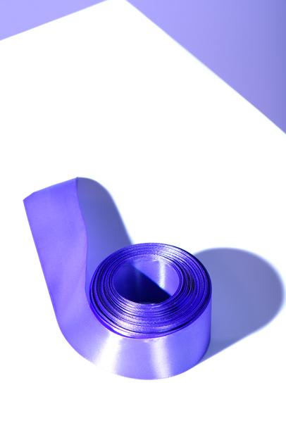 decorative purple ribbon, on white surface - Photo, Image