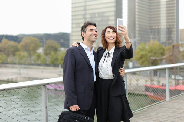    Marketer man and HR manager woman using smartphone taking sel - Photo, Image