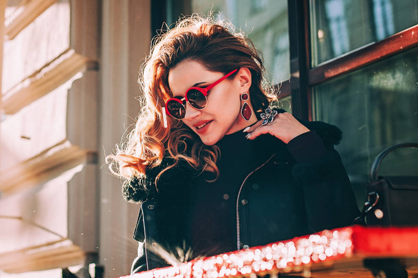 Fashionable Redhead  Woman with Red Earrings. Street style - Photo, Image