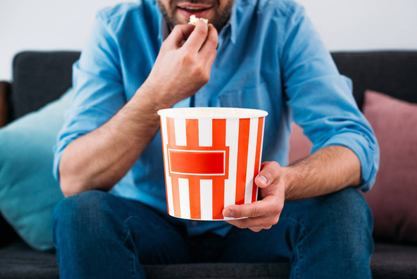 partial view of man eating popcorn - Photo, Image
