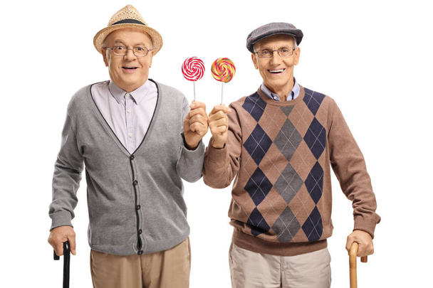 Seniors with lollipops isolated on white background - Foto, Imagen