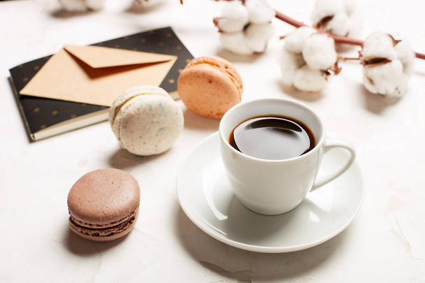 Traditional French almond caramel chocolate cranberry macarons dessert biscuits platter on white gray concrete textured background table top. Tasty but unhealthy food. - Foto, Imagem