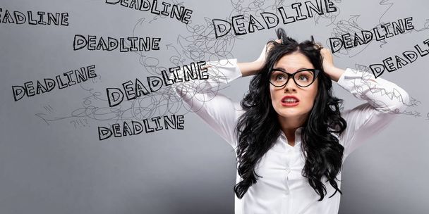 Deadline with business woman feeling stressed - Photo, Image