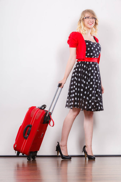 Elegant fashion woman with red suitcase - Fotó, kép