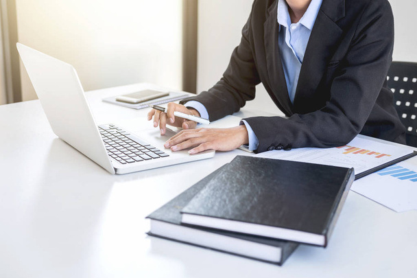 Intelligent female businesswoman working on laptop while analysi - Foto, Bild