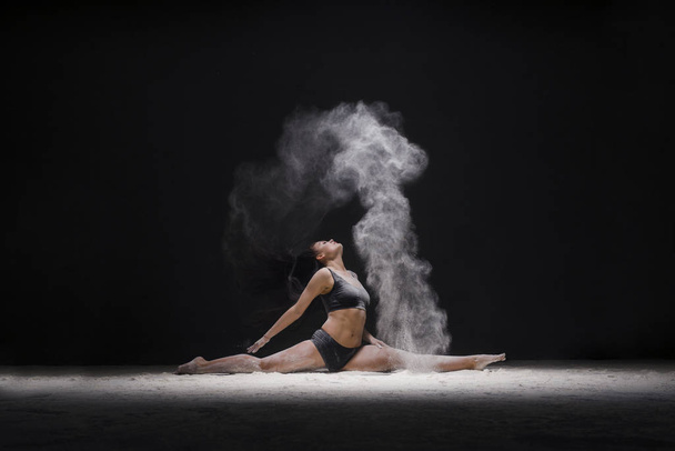Woman in a split view in a white dust cloud - Foto, Imagen