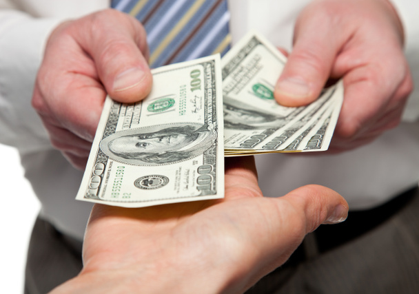 Людські руки обмінюються грошима
 - Фото, зображення