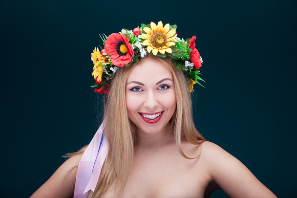Portrait of beautiful smiling woman with wreath on her head - Fotoğraf, Görsel