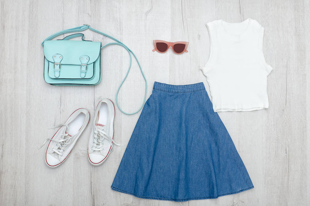 Jeans skirt, glasses, white t-shirt and sneakers - Photo, Image