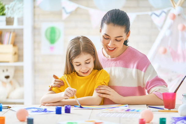 Mother and daughter painting together - Photo, image