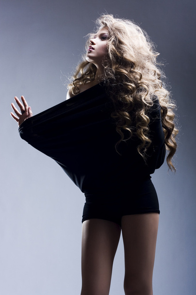 Beautiful woman with long curly hair - Fotografie, Obrázek