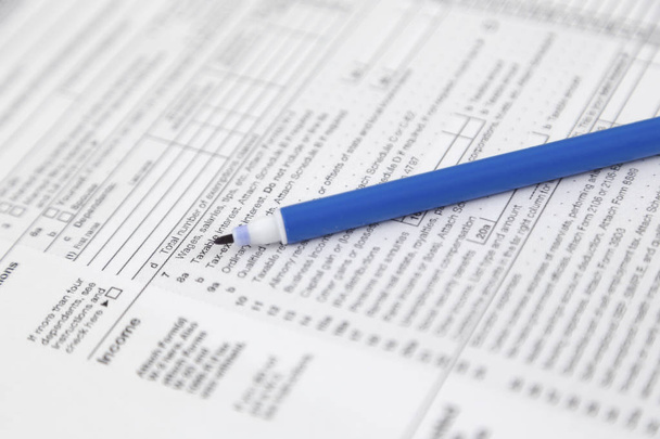 Blank income tax forms. American 1040 Individual Income Tax return form. - Photo, Image