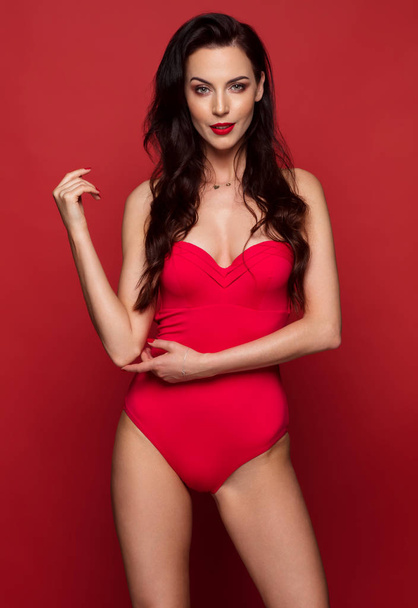 young woman wearing red swimsuit - 写真・画像
