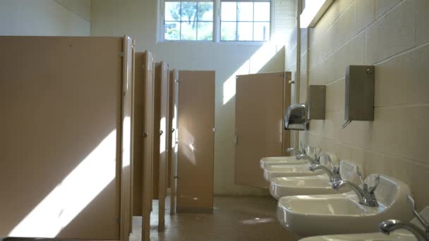 Establishing interior shot of empty public bathroom in the afternoon - ALT - Footage, Video