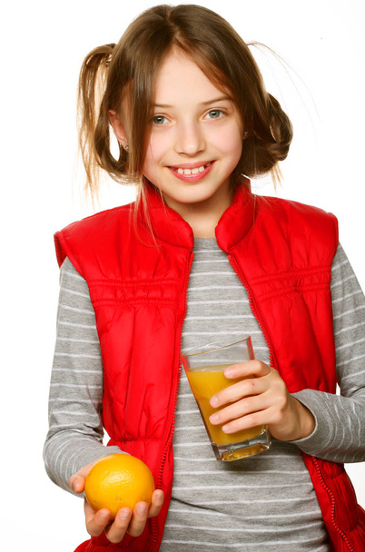   Little girl with oranges and juice - Fotó, kép