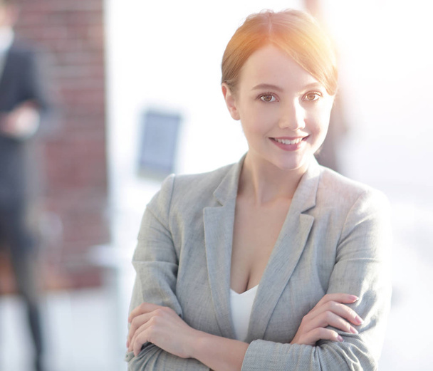 portrait of confident business woman on the background of the office. - Fotó, kép