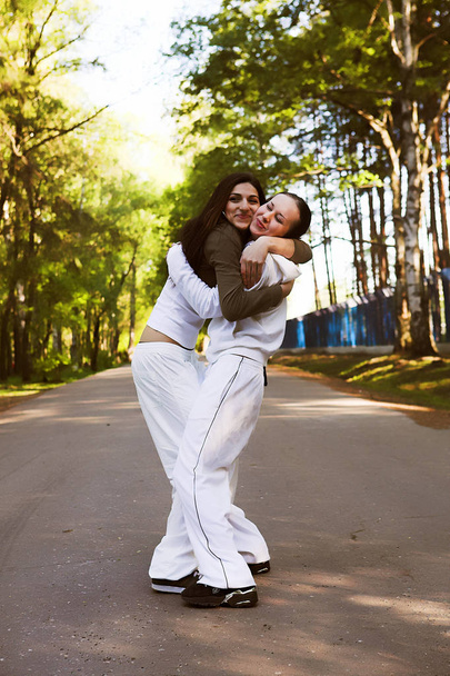 two sporty women in park - Valokuva, kuva