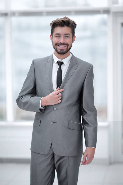 A young man in a gray suit - Fotó, kép