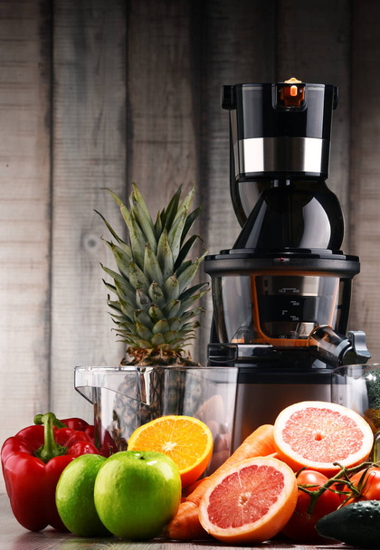 Slow juicer with organic fruits and vegetables. - Photo, Image