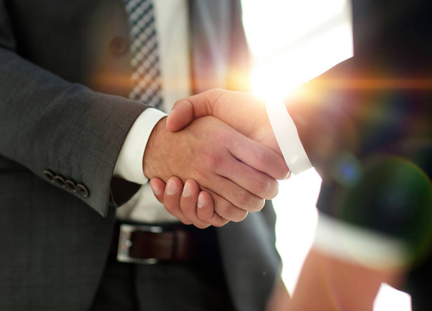 Businessman giving his hand for handshake to partner - Fotó, kép