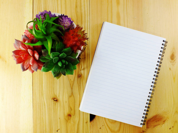 space of notebook paper top view on wooden background - Foto, Imagen