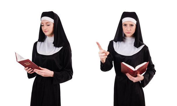 Young nun with bible isolated on white - Fotoğraf, Görsel