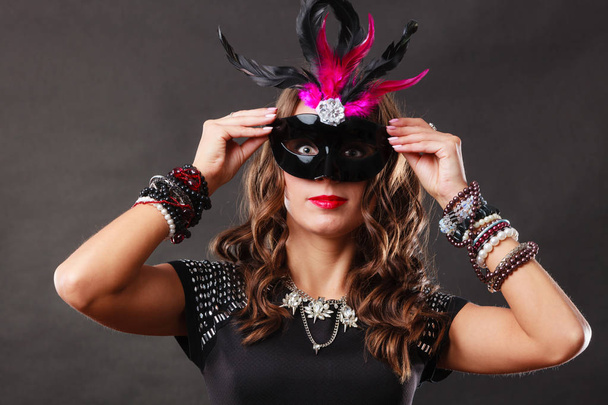 Woman with carnival venetian mask on dark - Photo, image