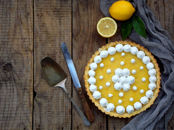 Lemon tart pie with meringue cream. Traditional American cake. Homemade baking. Copy space - Photo, Image
