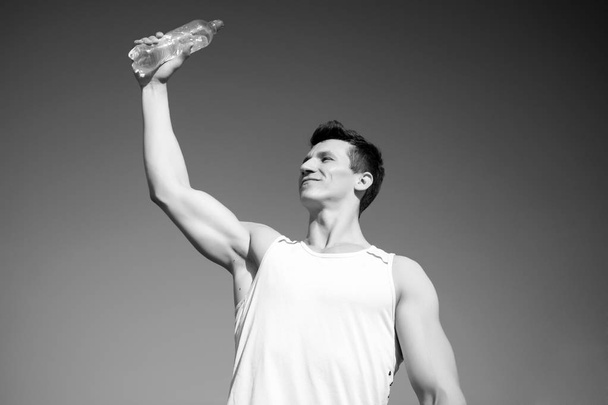 Bodybuilder with muscles, biceps, triceps on sunny day - Φωτογραφία, εικόνα