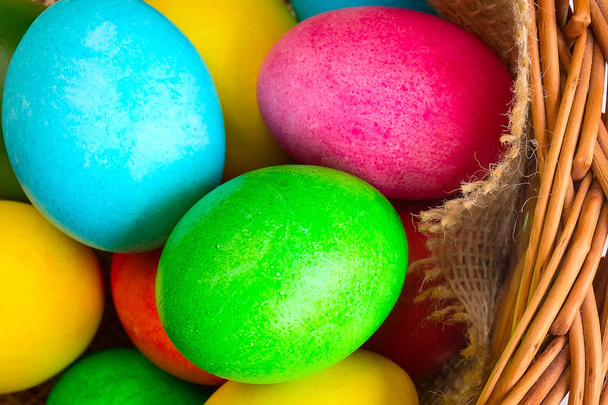Colored decorated Easter eggs in basket - Photo, image