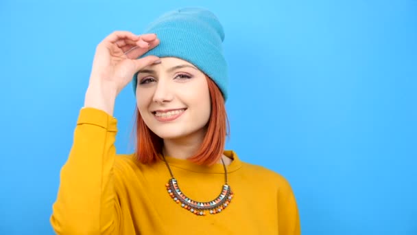 Young cool hipster girl wearing a blue hat - Felvétel, videó