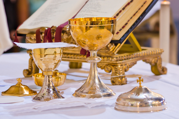 pisside and chalice contain wine and hosts on the altar of the m - Photo, Image