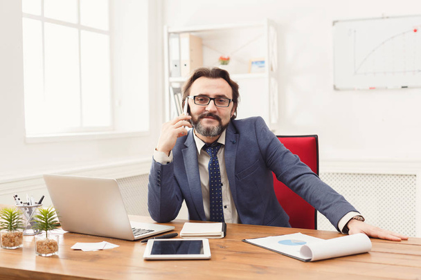 Confident businessman portrait in modern office - Photo, Image